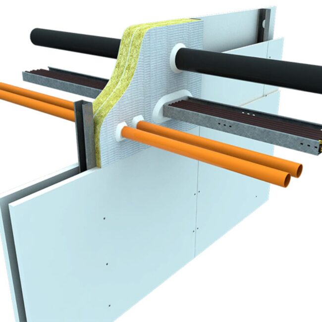 Cutaway of insulated pipes and cables passing through a wall, showing layers of pipe and wall materials.