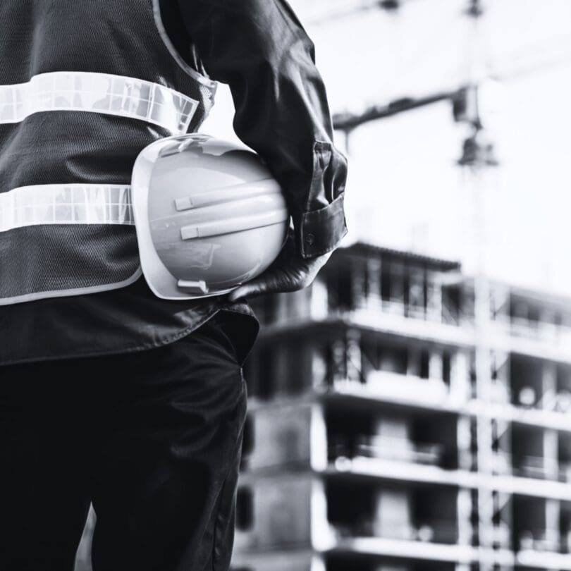 Worker with hard hat at a construction site.
